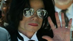 SANTA MARIA, CA - JUNE 13:  Michael Jackson waves to fans after he is found not guilty on all counts in his child molestation trial at the Santa Barbara County Courthouse June 13, 2005 in Santa Maria, California. Jackson was charged in a 10-count indictment with molesting a boy, plying him with liquor and conspiring to commit child abduction, false imprisonment and extortion.  (Photo by Frederick M. Brown/Getty Images)