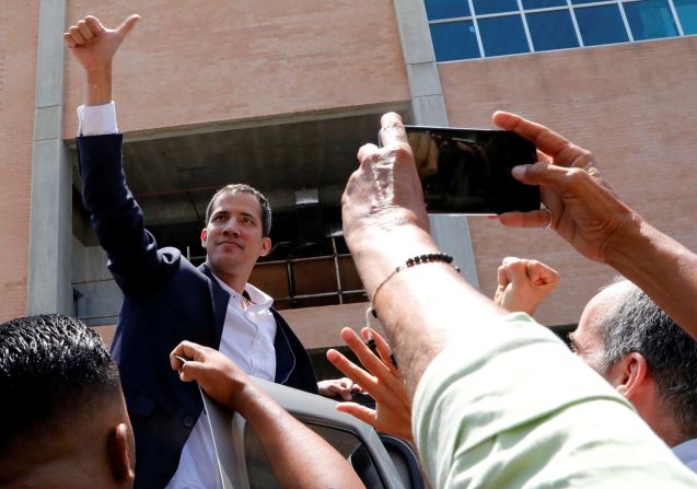 Guaido greets supporters upon arriving at a Caracas airport on March 4. He crossed the border to Colombia in late February before embarking on a South American tour, meeting the presidents of Colombia, Brazil, Paraguay and Ecuador, along with US Vice President Mike Pence. By doing so, Guaido <a href="index.php?page=&url=https%3A%2F%2Fwww.cnn.com%2F2019%2F03%2F04%2Famericas%2Fjuan-guaido-returns-venezuela-intl%2Findex.html" target="_blank">ignored a travel ban</a> imposed on him by the country's Supreme Court.