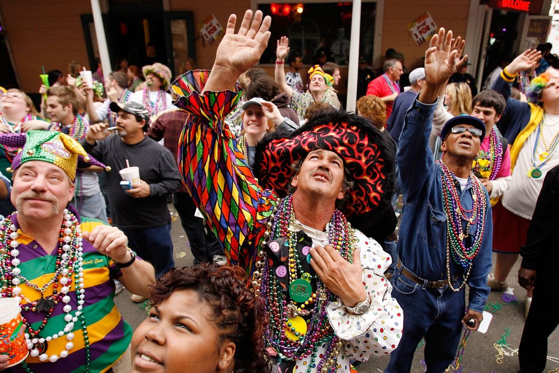 People shout for beads on Bourbon Street on Mardi Gras day back in 2007. The celebration took on even more meaning for New Orleans after Hurricane Katrina.