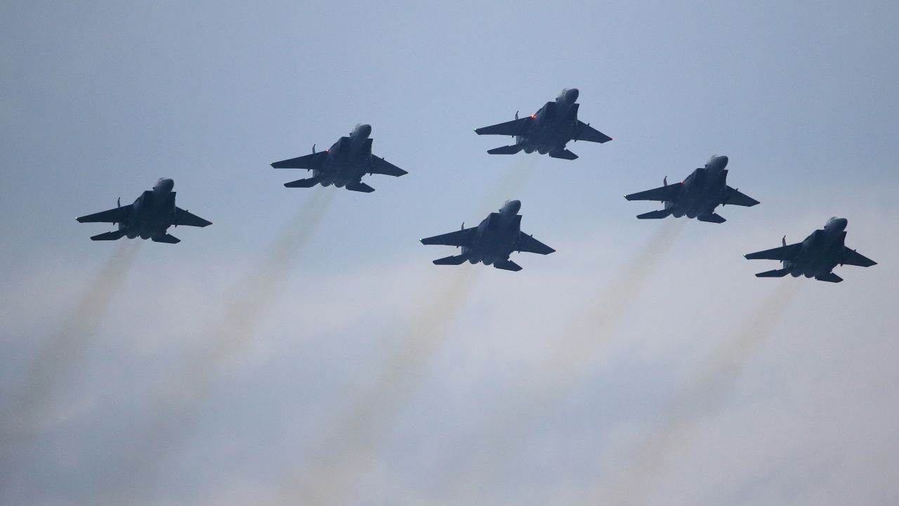 Singapore Air Force F-15SGs fighter aircraft flay as part of the National Day Parade in 2018. The jets would work in concert with the county's F-35s in the future.