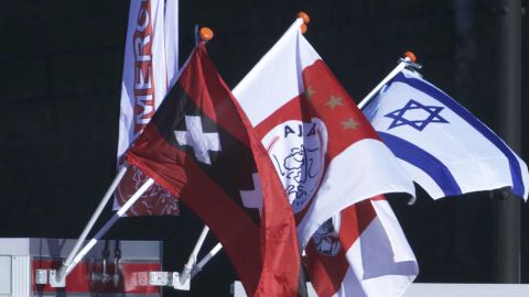 Stalls close to the Johan Cruyff Arena sell Israeli flags to supporters.