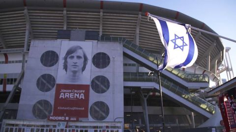 An Israeli flag can be seen flying outside the Ajax stadium in Amsterdam.