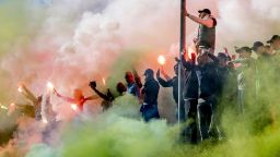 Supporters of the Dutch football team Feyenoord gather on February 26, 2019 at the training field to light flares and sing to the players prior to the final training leading up to the KNVB Cup match between Feyenoord and Ajax. (Photo by Robin UTRECHT / ANP / AFP) / Netherlands OUT        (Photo credit should read ROBIN UTRECHT/AFP/Getty Images)