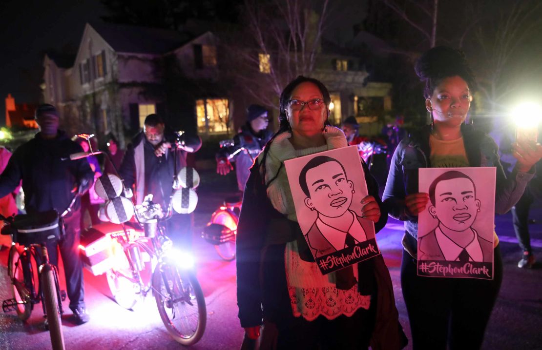 Protesters march through the streets as they demonstrate against a decision not to charge the Sacramento police officers who shot and killed Stephon Clark. 