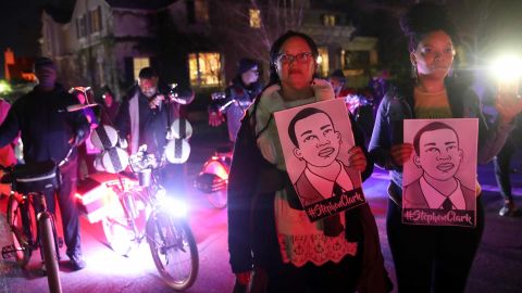 Protesters march through the streets as they demonstrate against a decision not to charge the Sacramento police officers who shot and killed Stephon Clark. 