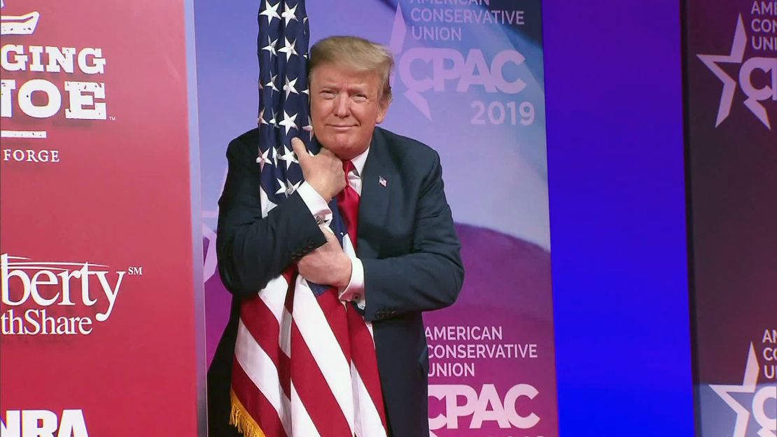 trump hugs flag