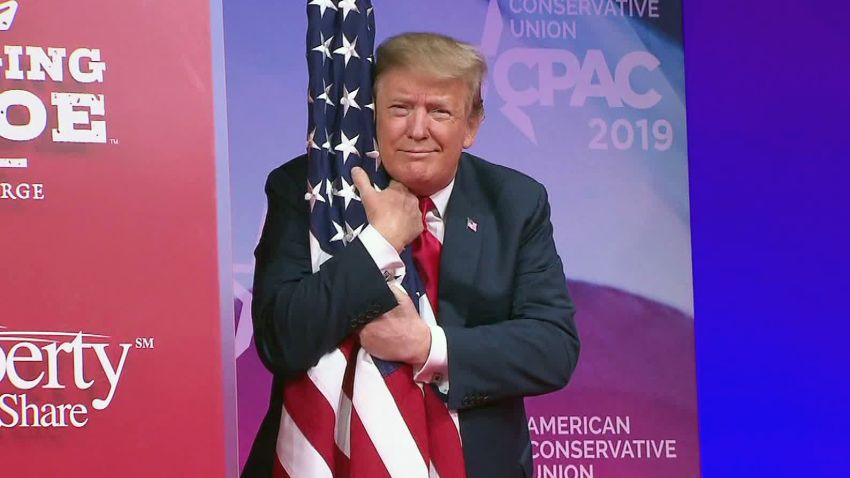 trump hugs flag