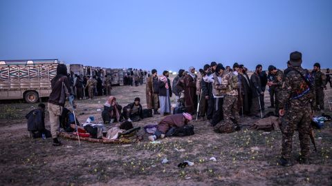 Suspected ISIS fighters who fled Baghouz await processing.