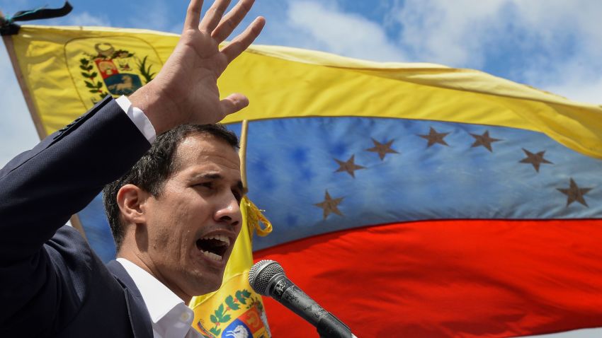 Venezuela's National Assembly head Juan Guaido speaks to the crowd during a mass opposition rally against leader Nicolas Maduro in which he declared himself the country's "acting president", on the anniversary of a 1958 uprising that overthrew a military dictatorship, in Caracas on January 23, 2019. - "I swear to formally assume the national executive powers as acting president of Venezuela to end the usurpation, (install) a transitional government and hold free elections," said Guaido as thousands of supporters cheered. Moments earlier, the loyalist-dominated Supreme Court ordered a criminal investigation of the opposition-controlled legislature. (Photo by Federico PARRA / AFP)        (Photo credit should read FEDERICO PARRA/AFP/Getty Images)