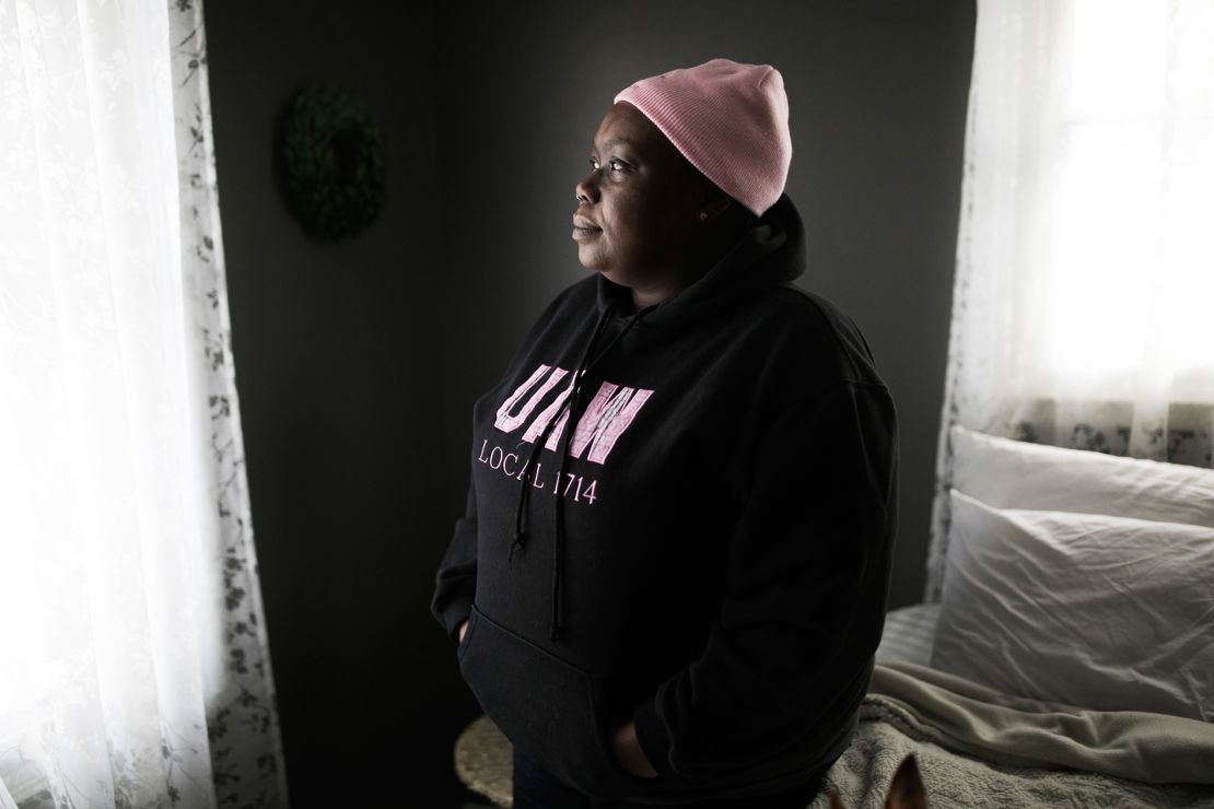 Felice Robinson stands in her home in Warren, Ohio, after getting off of the night shift at work at the Lordstown GM plant.
