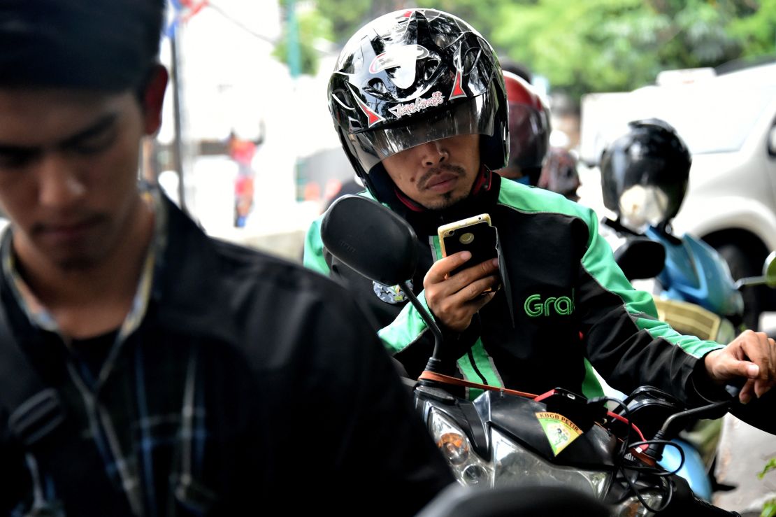 A GrabBike rider in Jakarta. Grab plans to use a lot of the recent money it has raised to beef up its business in Indonesia. 