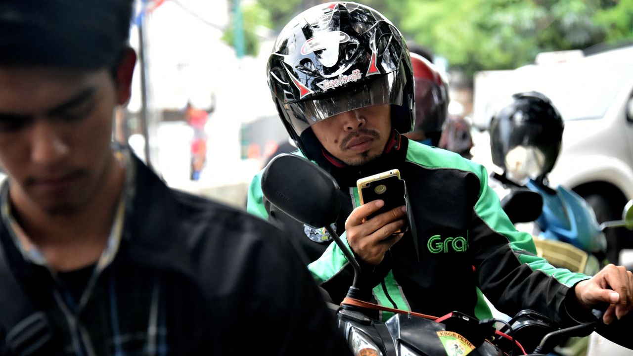 A GrabBike rider in Jakarta. Grab plans to use a lot of the recent money it has raised to beef up its business in Indonesia. 