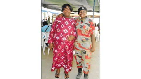 Thelma (right), with her mother, at her graduation from fire service training school.
