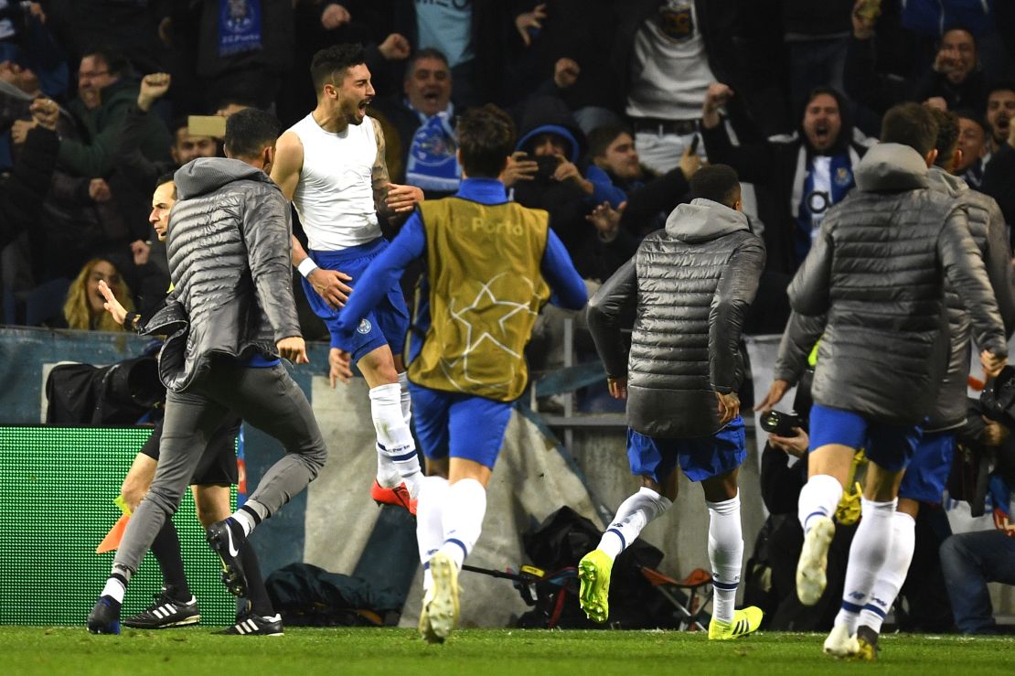 Porto celebrates Alex Telles 117th-minute winner.