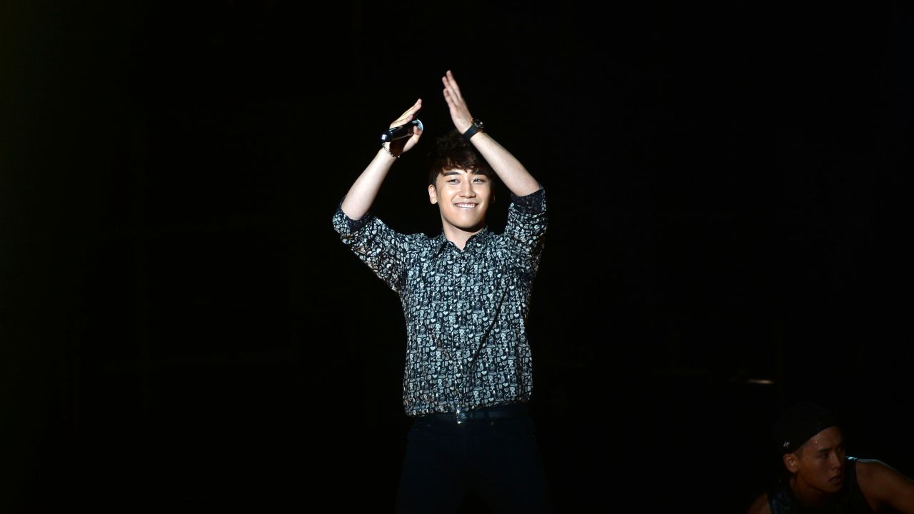 Seungri of South Korean boy band Big Bang performs on stage during a fans meeting on June 14, 2014 in Chengdu, China.