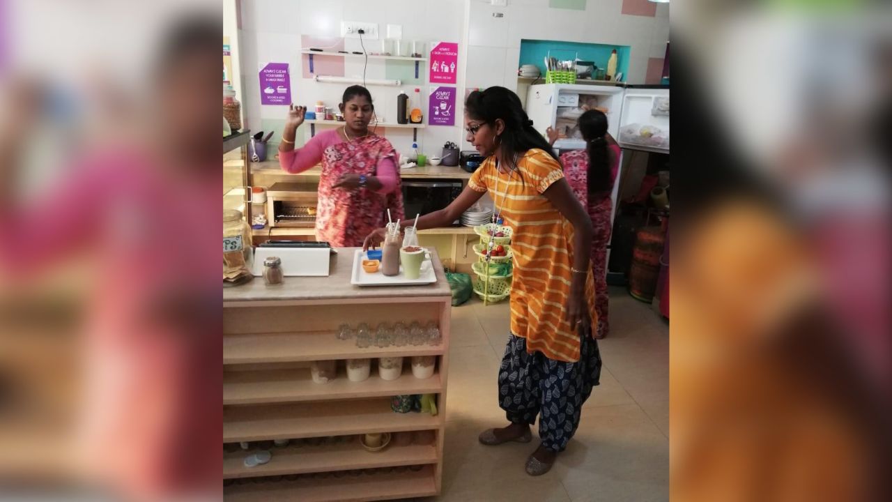 Employees prepare the shop for customers.