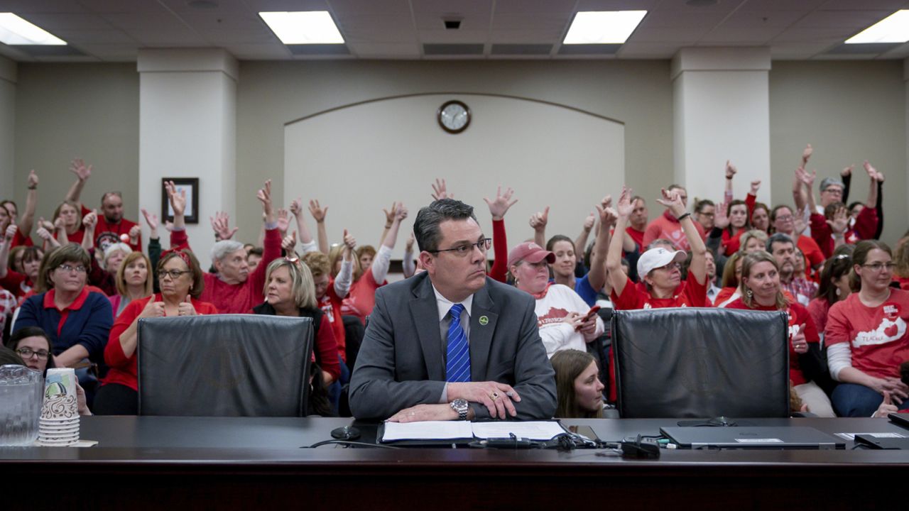 In a room packed with teachers, Kentucky state Rep. Ken Upchurch talks about a bill that will change how individuals are nominated to the Kentucky teachers retirement systems board of trustees.