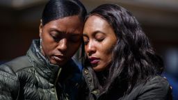 Krystal Stenson-Garrett, left, mourns with her cousin Montasha Preston outside the Peterson and Williams Funeral Home in Opelika, AL on Wednesday, March 6, 2019. Preston was a survivor of the tornadoes that hit Lee County and killed four members of her and Krystal's family.