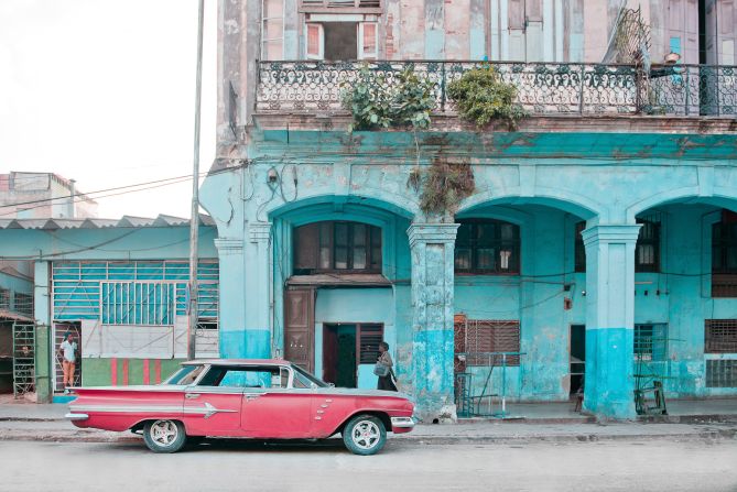 Many of the photographs show the crumbling facades of the city's colorful buildings. 