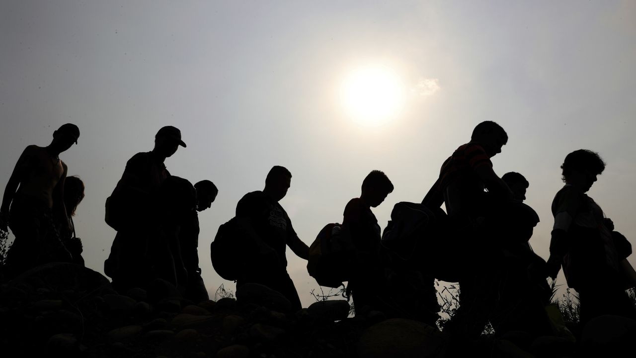 Venezuelans cross illegally into Colombia near the Simon Bolivar International Bridge on Tuesday, March 5. <a href="https://www.cnn.com/2019/01/24/americas/gallery/venezuela-political-crisis/index.html" target="_blank">Venezuela is facing a severe economic crisis,</a> and President Nicolas Maduro is under increasing pressure from the United States and other countries to step down.