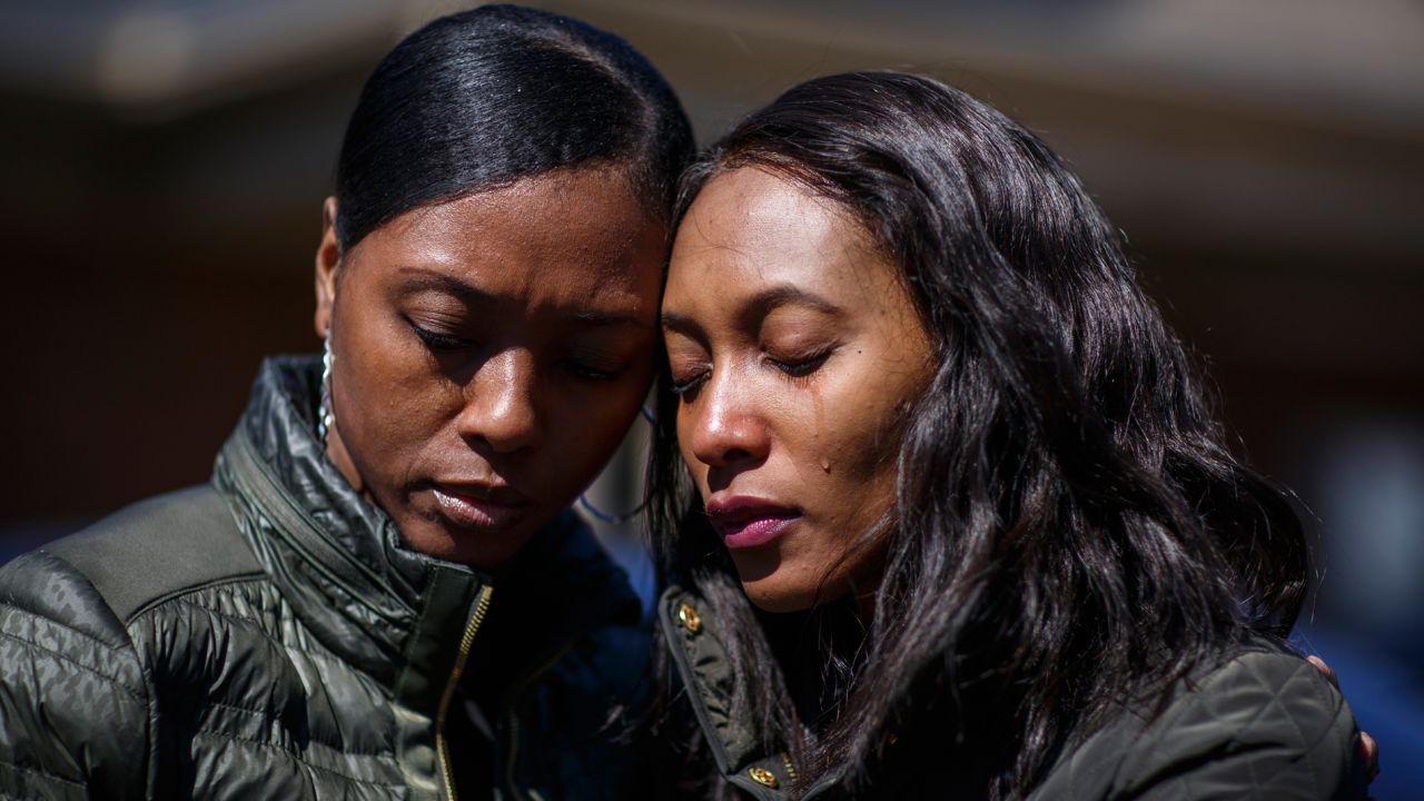 Krystal Stenson-Garrett, left, mourns with her cousin Montasha Preston outside a funeral home in Opelika, Alabama, on Wednesday, March 6. They lost four family members to <a href="https://www.cnn.com/2019/03/04/weather/gallery/southeast-tornadoes/index.html" target="_blank">the tornadoes</a> that hit Alabama's Lee County on Sunday.