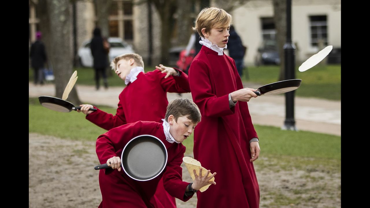 Choristers from the Winchester Cathedral pose for pictures during a pancake fundraiser in Winchester, England, on Tuesday, March 5.