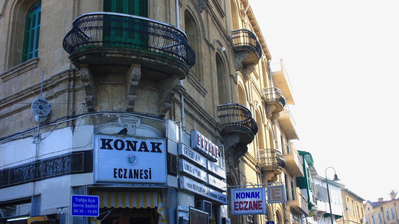 Historic architecture flanks the buffer zone on both sides of Nicosia, with Greek signs giving way to Turkish ones when crossing from south to north. 
