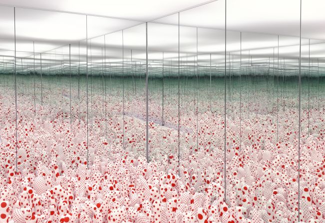 The floor of "Infinity Mirror Room -- Phalli's Field" covered with stuffed polka-dot phalluses.
