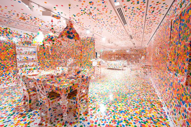 Kusama's "Obliteration Room" installations invite visitors to cover surfaces in colored stickers.