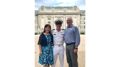 Thomas Krasnican, co-host of the "Thank You For Your Service" podcast, with his parents at the US Naval Academy.