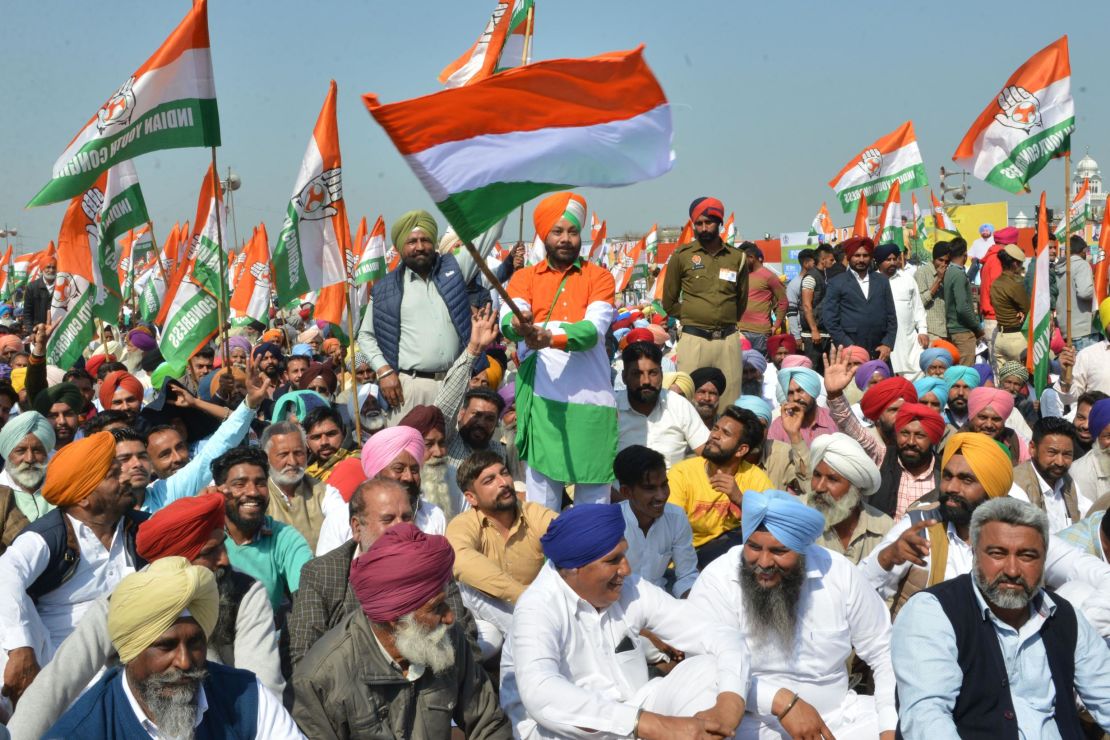 Congress party supporters hold party flags during the launch of the party's campaign in Punjab ahead of the upcoming elections.