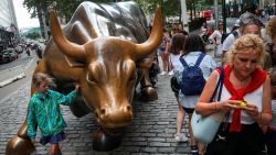 NEW YORK, NY - AUGUST 22: Tourists visit the Wall Street bull statue in the Financial District, August 22, 2018 in New York City. Today marks the longest bull market rally in U.S. history, stretching back to March 2009. The longest previous market rally was from 1990 to March 2000. (Photo by Drew Angerer/Getty Images)