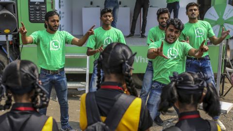 WhatsApp ambassadors perform a skit during a roadshow for the messaging service in Pune, India in October. Cheap phones and rock-bottom rates mean more Indians are using the app.