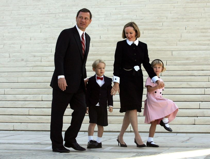 The Roberts walk with their children, Jake and Josie, after he took the Supreme Court bench for the first time in October 2005.