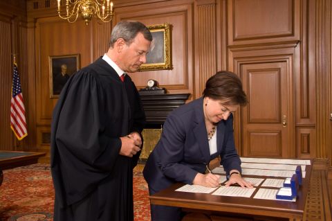 Roberts watches Elena Kagan sign the Oaths of Office after she replaced retiring Justice John Paul Stevens in 2010.