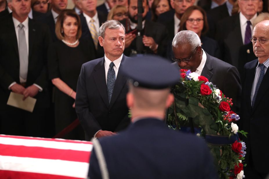 Roberts and Thomas pay their respects to the late President George H.W. Bush as he lies in state in December 2018.