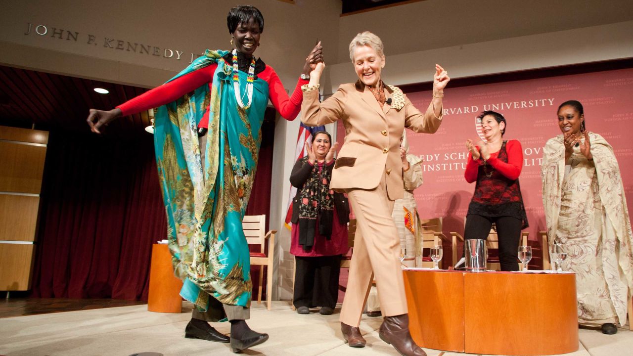 South Sudanese Cabinet member Rebecca Joshua Okwaci dances with Swanee Hunt at the John F Kennedy Jr. Forum at Harvard University's Kennedy School of Government in 2012.