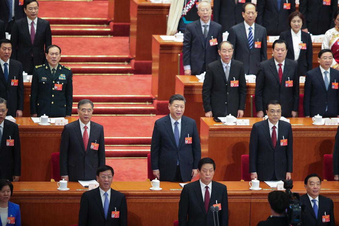 Chinese President Xi Jinping and other officials stand during the opening session of the National People's Congress at the Great Hall of the People on March 5, 2019 in Beijing, China. 