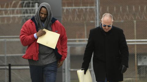 Singer R. Kelly left, walks with his attorney Steve Greenberg right, after being released from Cook County Jail, March 9, 2019, in Chicago. (AP Photo/Paul Beaty)