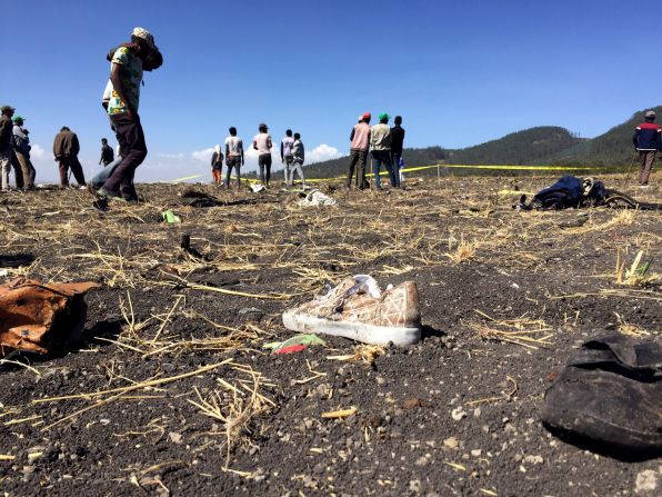 Personal effects are strewn on the ground at the crash site.