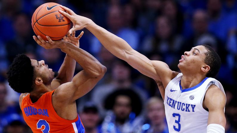 University of Kentucky guard Keldon Johnson blocks a shot attempt by Jalen Hudson of the Florida Gators in the first half of an NCAA basketball game on Saturday, March 9, in Lexington, Kentucky.