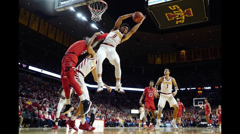 Iowa State guard Lindell Wigginton grabs a rebound over Texas Tech center Norense Odiase, left, during the first half of an NCAA basketball game on Saturday, March 9, in Ames, Iowa. <a href="index.php?page=&url=https%3A%2F%2Fwww.cnn.com%2F2019%2F03%2F03%2Fsport%2Fgallery%2Fwhat-a-shot-sports-0303%2Findex.html" target="_blank">See 27 amazing sports photos from last week</a>