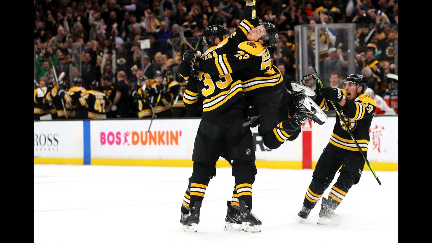 From left, Zdeno Chara, Charlie McAvoy and Brad Marchand of the Boston Bruins celebrate with Patrice Bergeron after he scored the game winning goal during an NHL game against the Florida Panthers on Thursday, March 7 at TD Garden.
