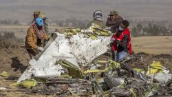 Rescuers work at the scene of an Ethiopian Airlines flight crash near Bishoftu, or Debre Zeit, south of Addis Ababa, Ethiopia, Monday, March 11, 2019. A spokesman says Ethiopian Airlines has grounded all its Boeing 737 Max 8 aircraft as a safety precaution, following the crash of one of its planes in which 157 people were killed. (AP Photo/Mulugeta Ayene)