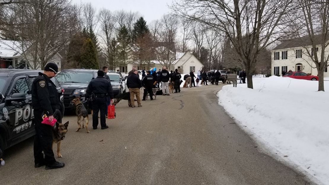 Police officers and K-9s line up to meet dog lover Emma Mertens, who is fighting a rare cancer called Diffuse Intrinsic Pontine Glioma (DPIG).