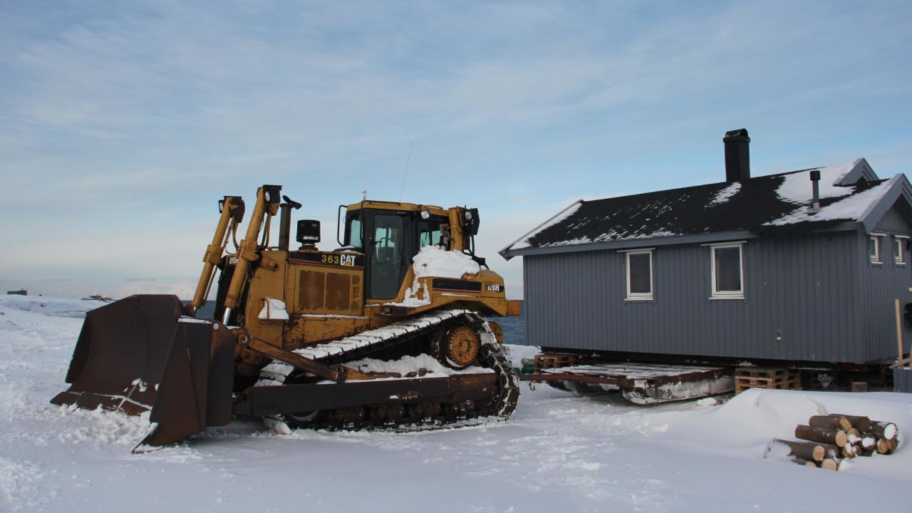 Christiane Hubner's hut is loaded onto the sled that will transport it to inland to a safe location.