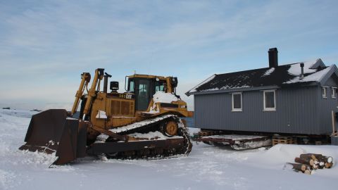 Christiane Hubner's hut is loaded onto the sled that will transport it to inland to a safe location.