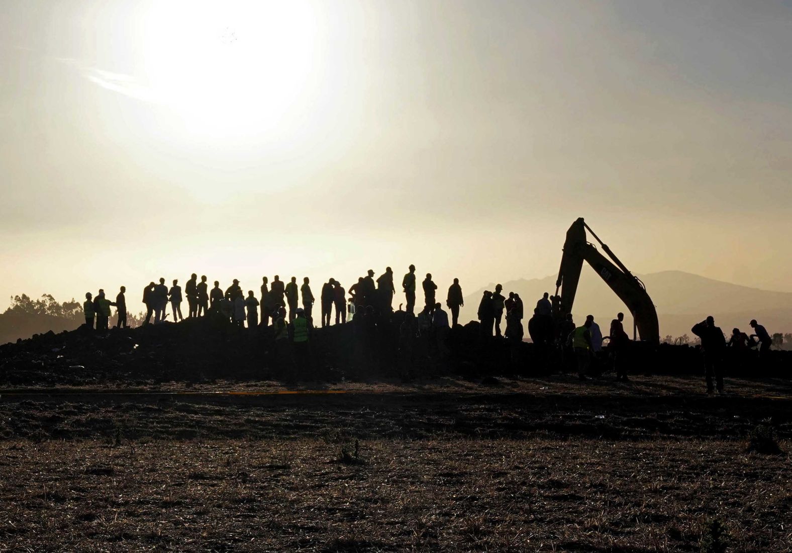 A recovery crew works at the scene on March 10.