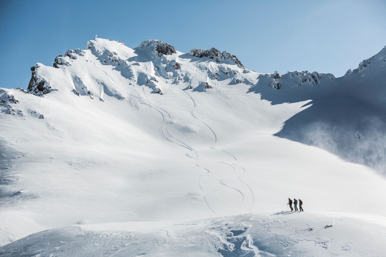 Beneath the summit, the skiers found an untouched, snow-filled scene.