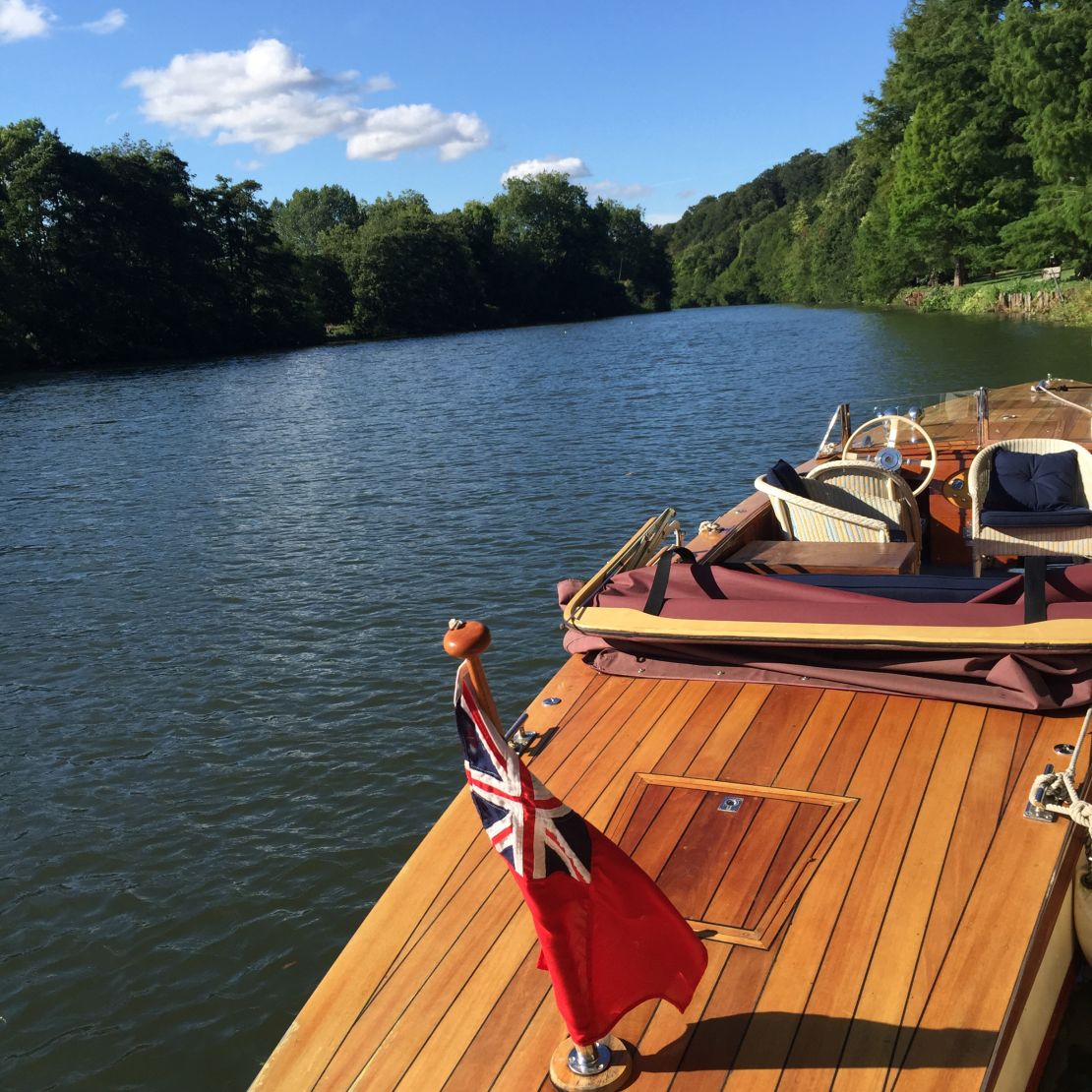 Cliveden House's vintage boats take guests on a jaunt down the River Thames.